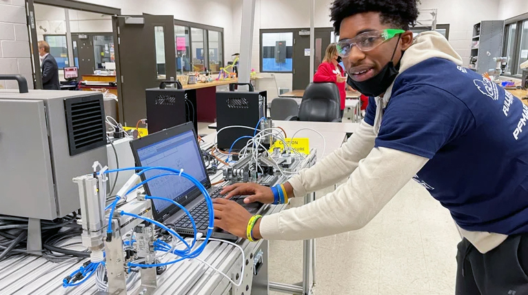 High school student Tyree’ Alexander shows off his robot programming skills with equipment provided by SMEEF’s PRIME initiative. (All Images provide by SME Photo/Bruce Morey)