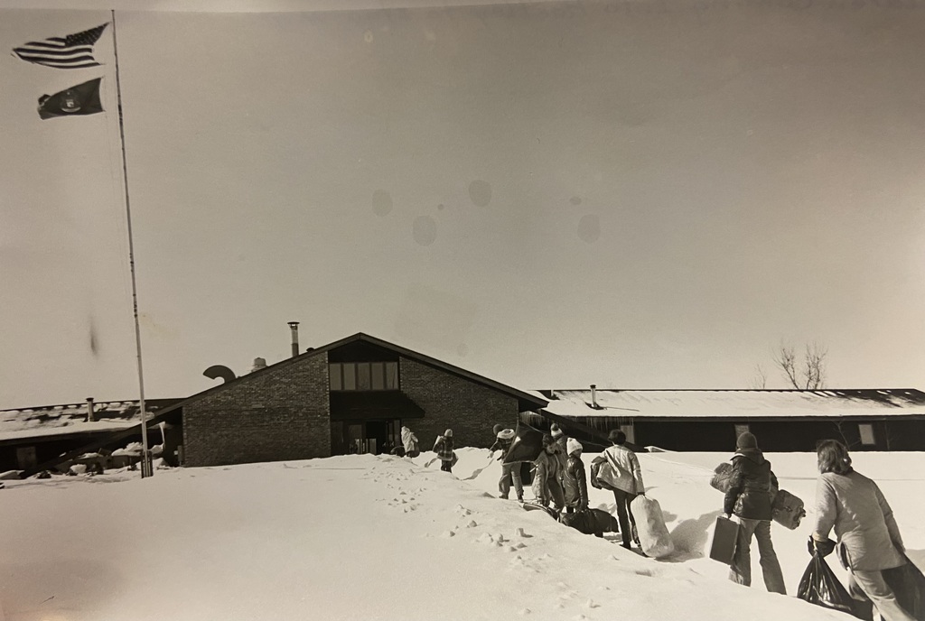 Students walking up to main building in winter